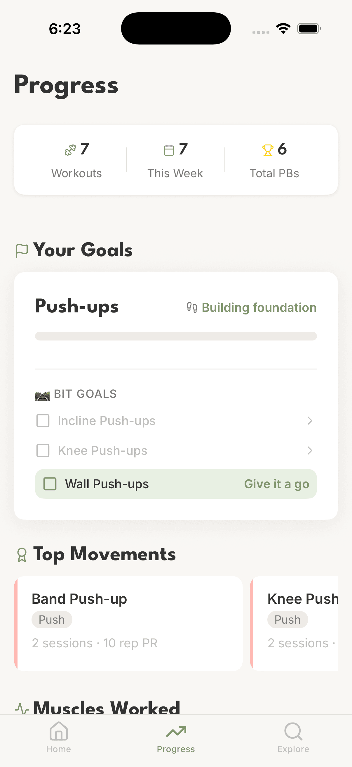 Goals screen showing progression, top movements, and muscles worked